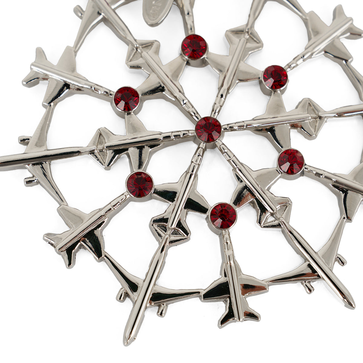 The BOEING 2025 Jet Snowflake Ornament features silver airplane-shaped pieces arranged in a circle, each meeting at a red jeweled center—creating a striking geometric pattern that’s the perfect holiday gift for any 787 Dreamliner fan.