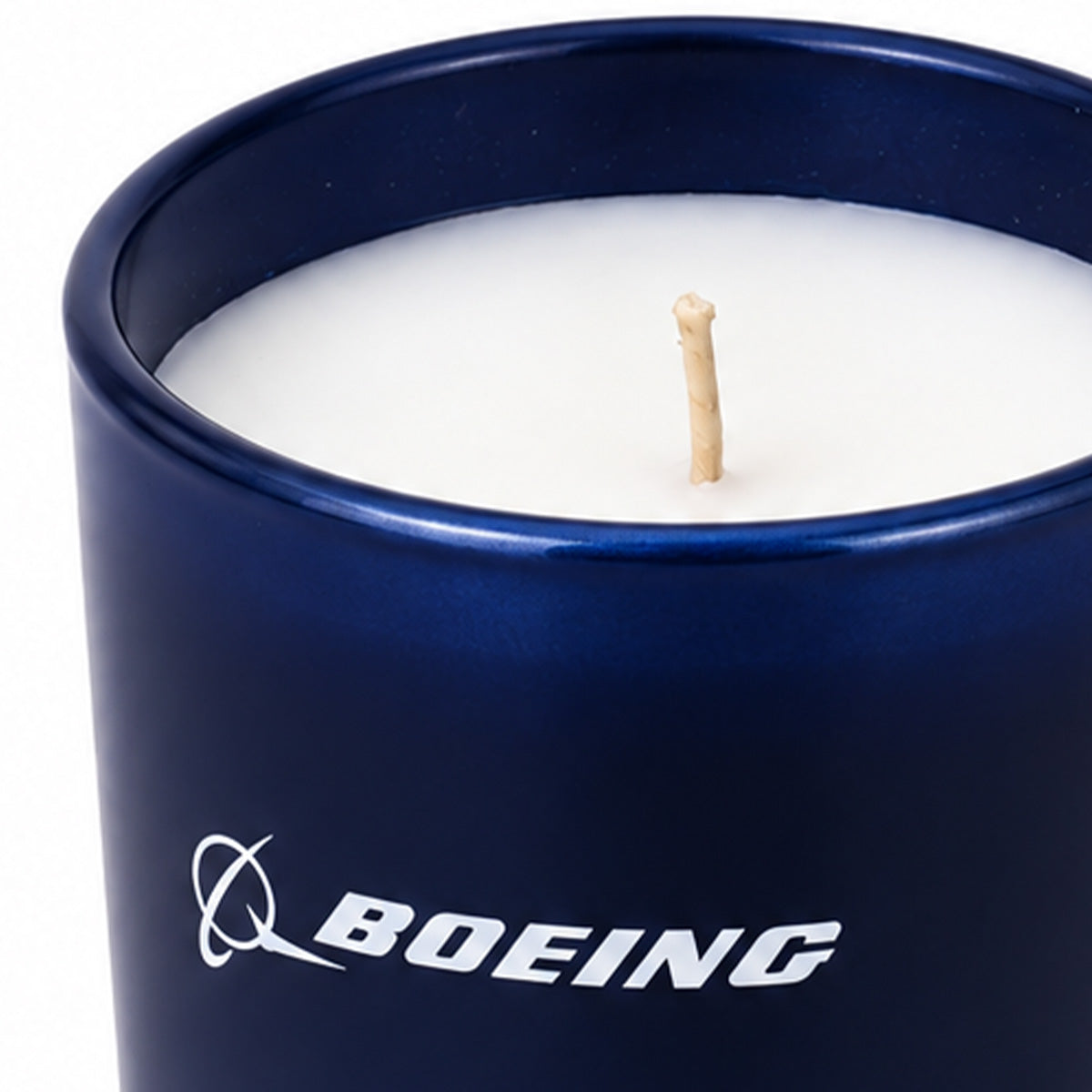 A white Boeing 2026 Signature Candle in a glossy dark blue jar with the company logo printed on the side.