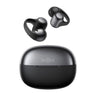 A pair of black Shokz OpenDots Earbuds by BOEING, featuring ear hooks and renowned for their long battery life, are displayed above a matching black charging case labeled SHOKZ on a white background.