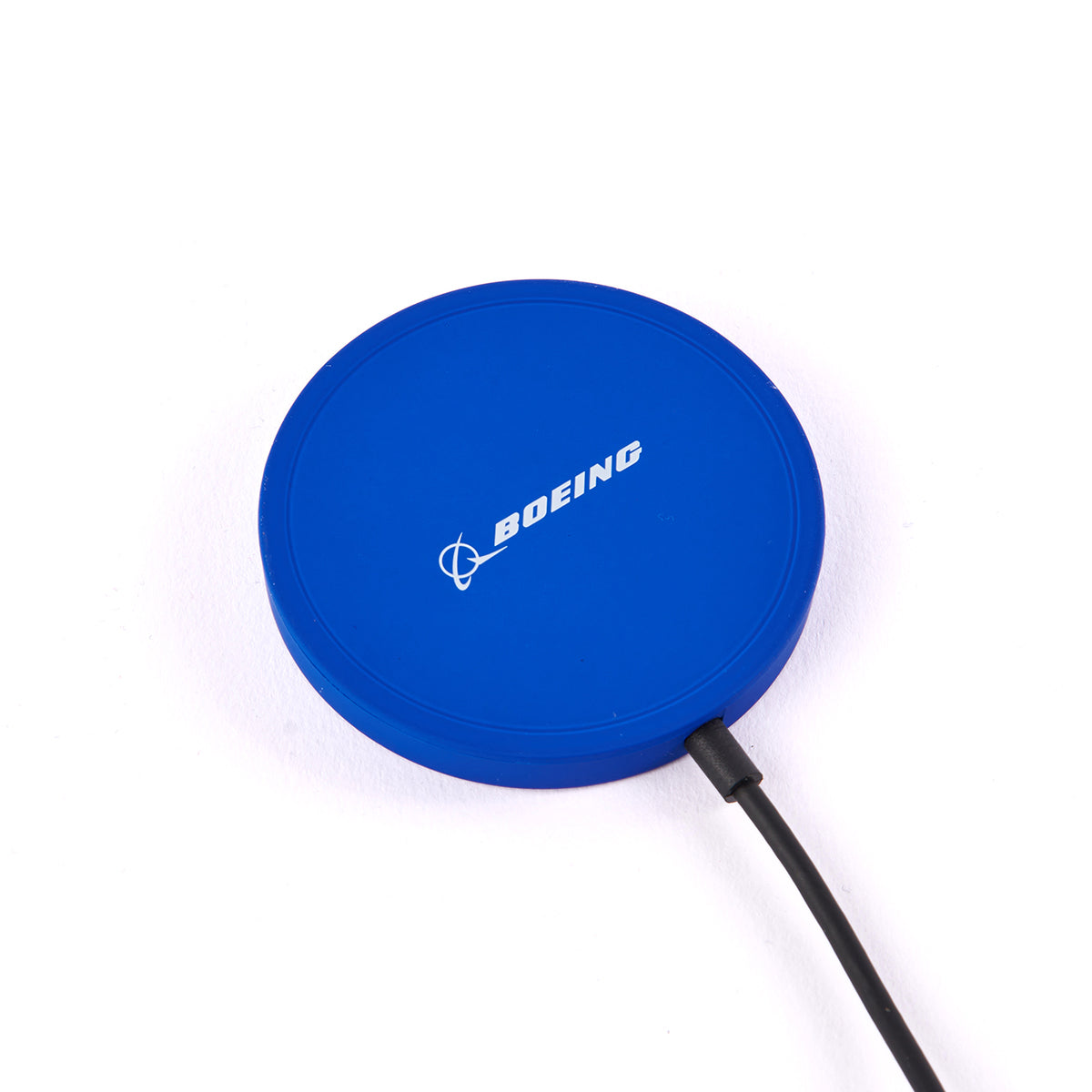 The Boeing Stores blue circular Wireless Magnetic Charger, featuring the Boeing logo, provides fast and secure charging with multi-protection. It includes a black side-connected cable, set against a white background.