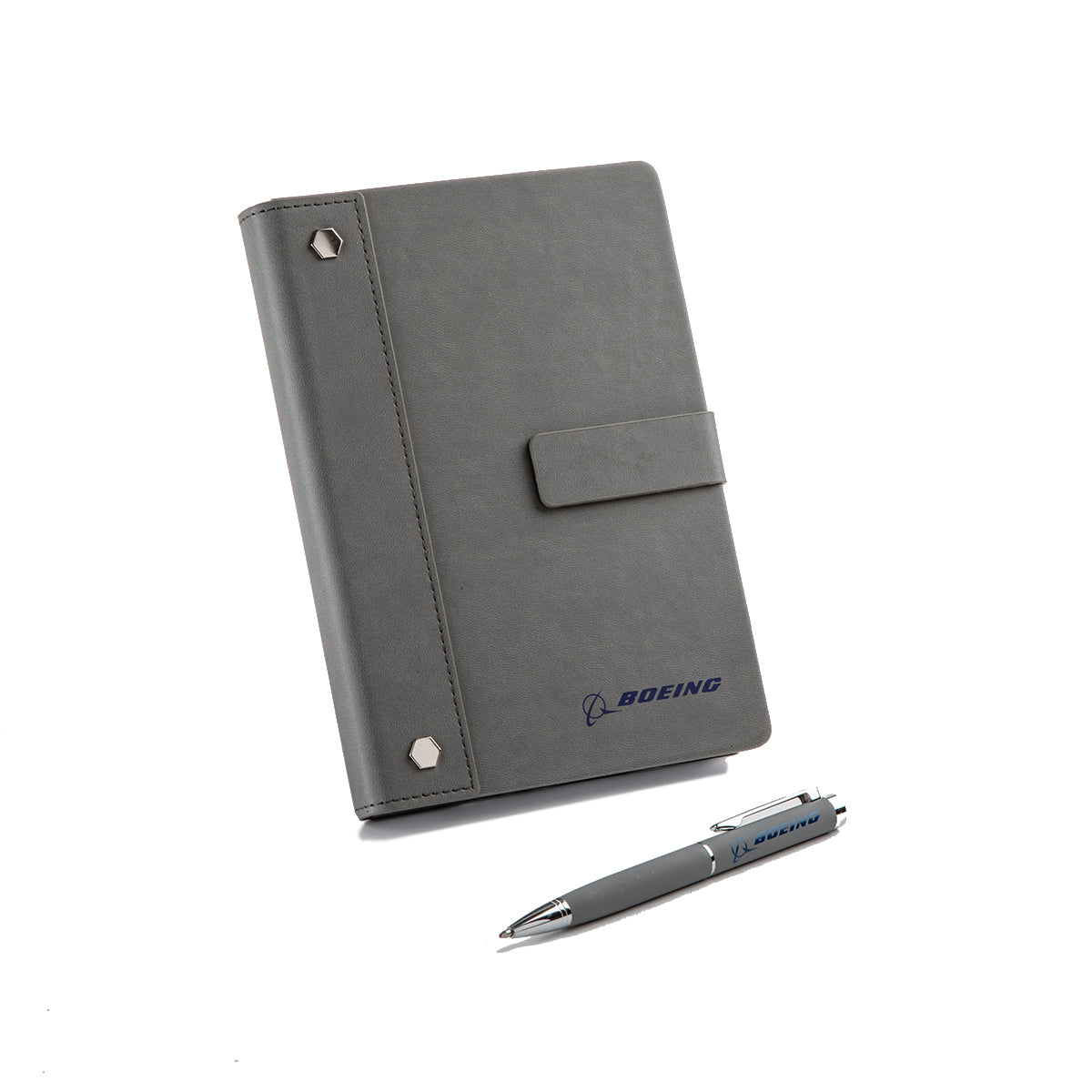 The BOEING Signature Logo Notebook Pen Set includes a gray PU leather notebook with a snap closure, metal spine studs, and blue Boeing logo, plus a matching pen set—all displayed on a white background.