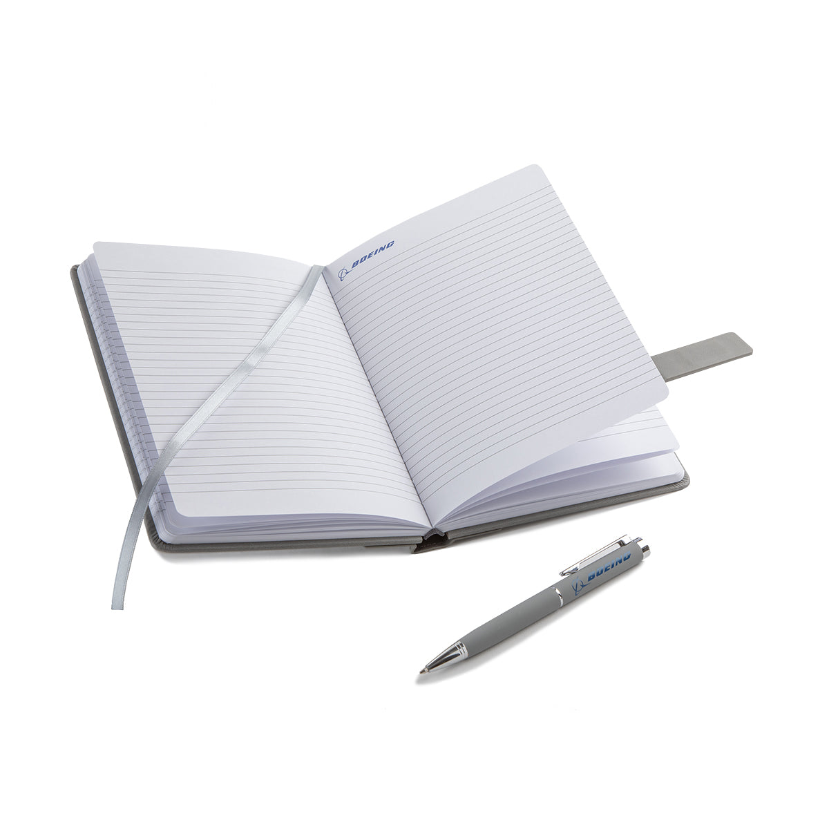 The BOEING Signature Logo Notebook Pen Set, featuring an open PU leather notebook with a silver ribbon bookmark and matching logo pen, is displayed on a white background with the iconic Boeing logo.