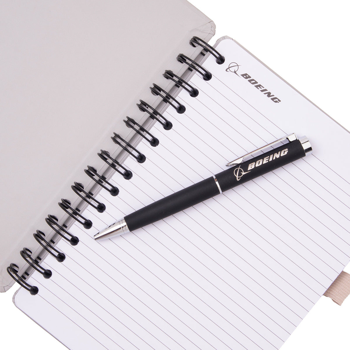 A Boeing KC-46A Pegasus Graphic Notebook Pen Set featuring a spiral-bound notebook with lined pages and a matching black ballpoint pen, both decorated with the KC-46A Pegasus logo.