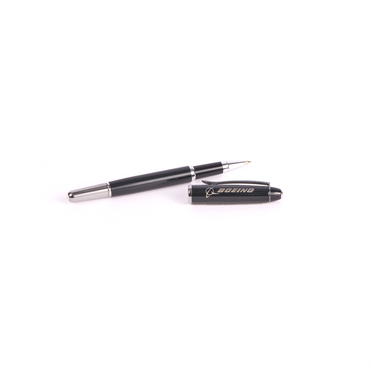 The Boeing Stores Boeing Shimmer Rollerball Pen, crafted from sleek black stainless steel with silver accents and a silver tip, is displayed with its cap off beside it. The cap features the white Boeing logo against a plain white background, perfect for all your writing tasks.