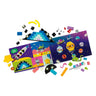 LEGO® Creative Space Planets by LEGO features colorful open books, outer space-themed illustrations, small toy pieces like stars, robots, a space shuttle, and glow-in-the-dark bricks scattered on a white background.