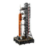 The LEGO® NASA Artemis SLS Set by LEGO features a detailed multistage orange rocket, white booster, and gray launch tower on a black display base.