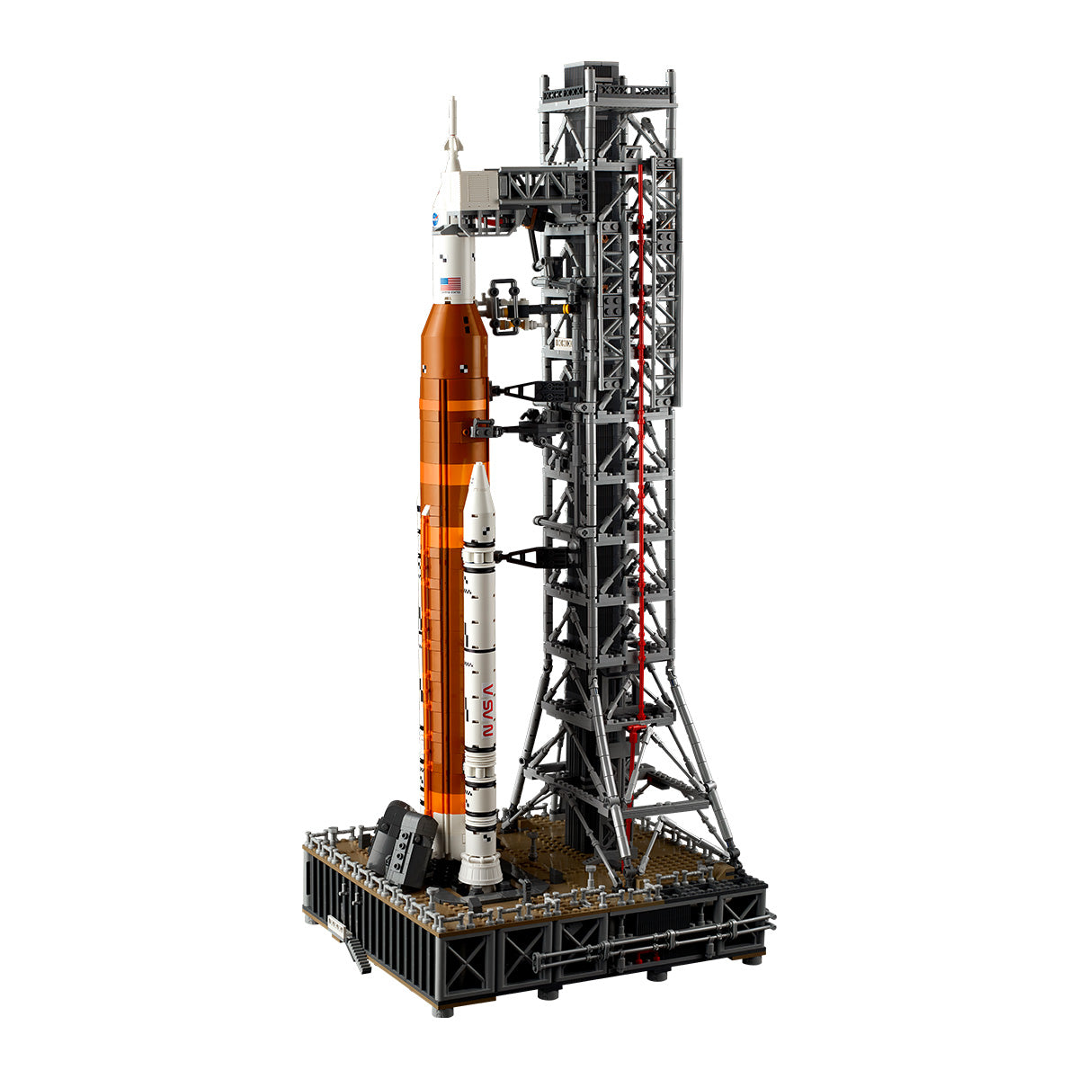 The LEGO® NASA Artemis SLS Set by LEGO features a detailed multistage orange rocket, white booster, and gray launch tower on a black display base.