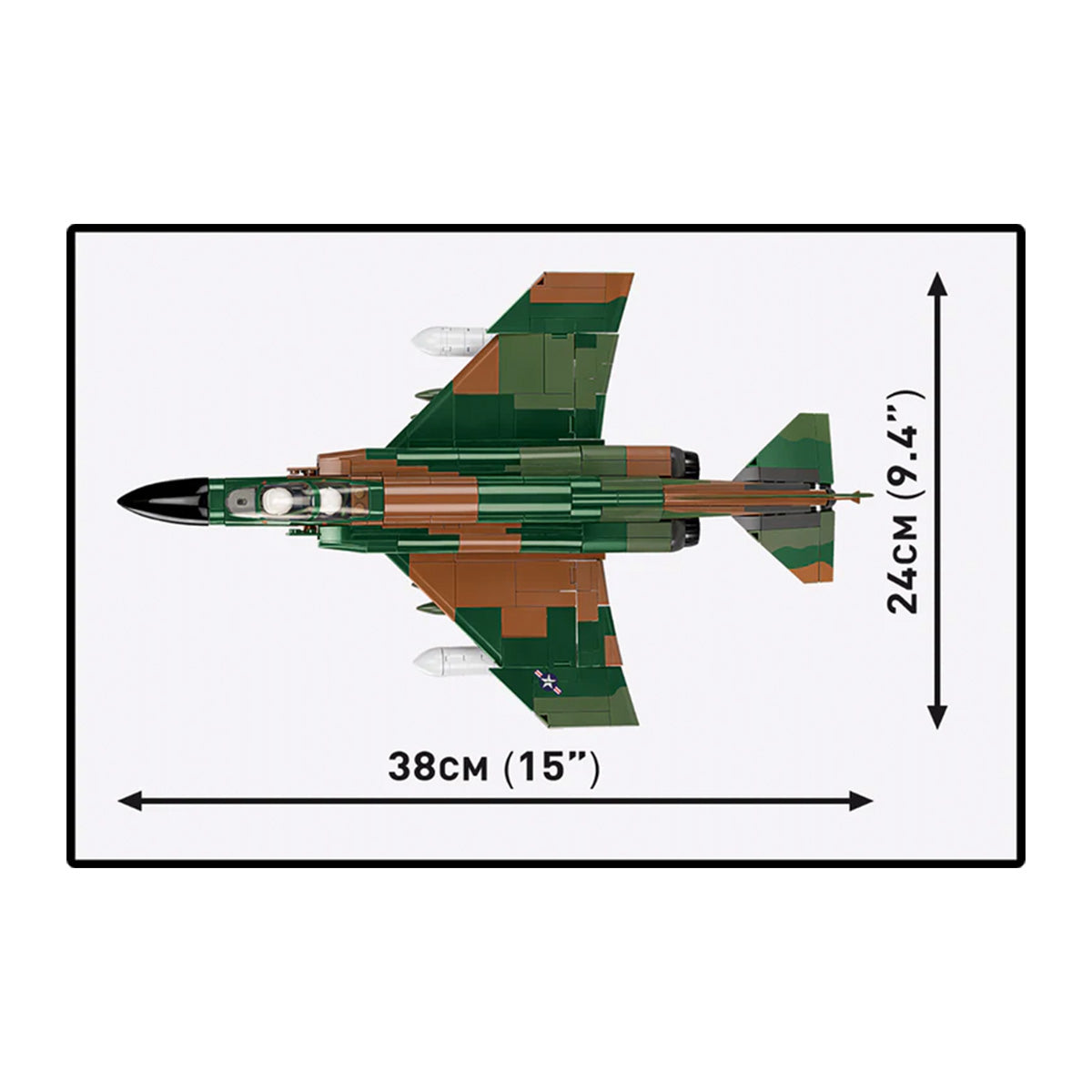 Top view of the COBI F-4C Phantom II fighter jet toy by BOEING, featuring a green, brown, and black color scheme. Dimensions: 38 cm (15 in) long and 24 cm (9.4 in) wide. Displayed on a white background.