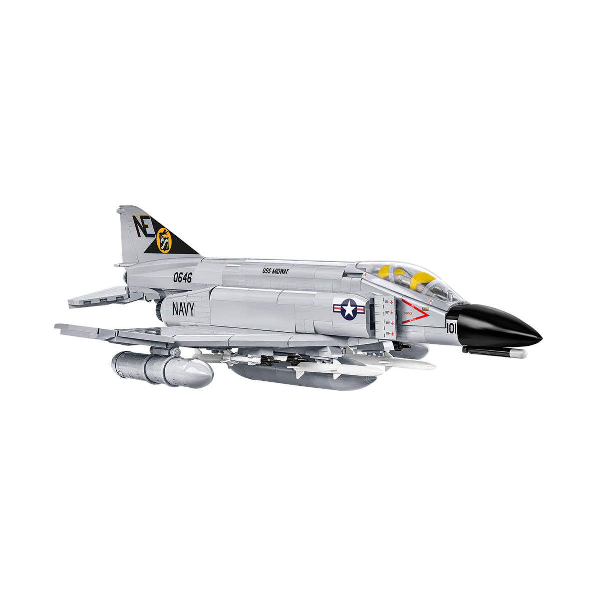 Side view of a gray and black BOEING COBI F-4 Phantom II building block model kit, featuring U.S. Navy markings, visible missiles, and a yellow-black tail emblem, shown on a white background.