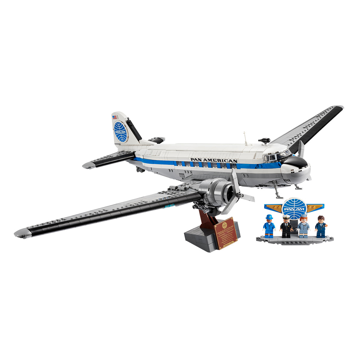 The LEGO® Boeing Douglas DC-3 PAN AM Airliner by BOEING includes a display stand, plaque, and four minifigures in blue uniforms by a Pan Am logo—an impressive collectible airplane model kit for fans and collectors.