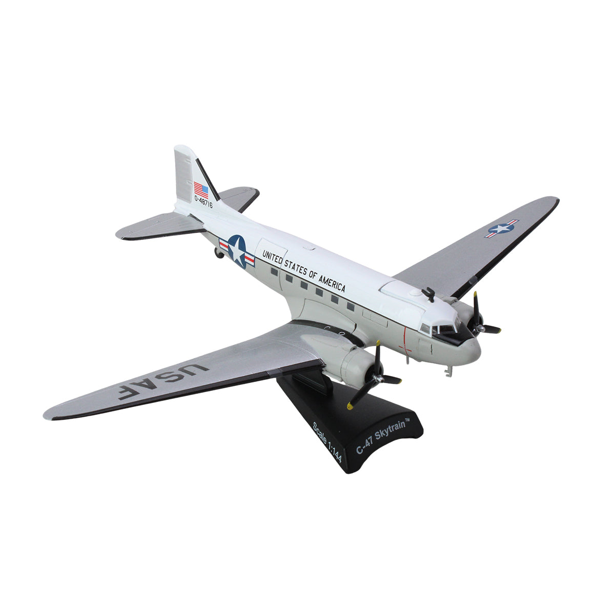 The DARON Boeing C-47 Skytrain United States of America Diecast Model is a 1:144 scale replica, painted white and gray with UNITED STATES OF AMERICA on the fuselage, and comes mounted on a black stand.
