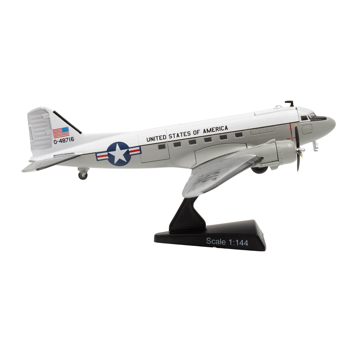 The DARON Boeing C-47 Skytrain United States Of America Diecast Model is a 1:144 scale replica with white U.S. military markings, a blue star insignia, and comes displayed on a black stand.