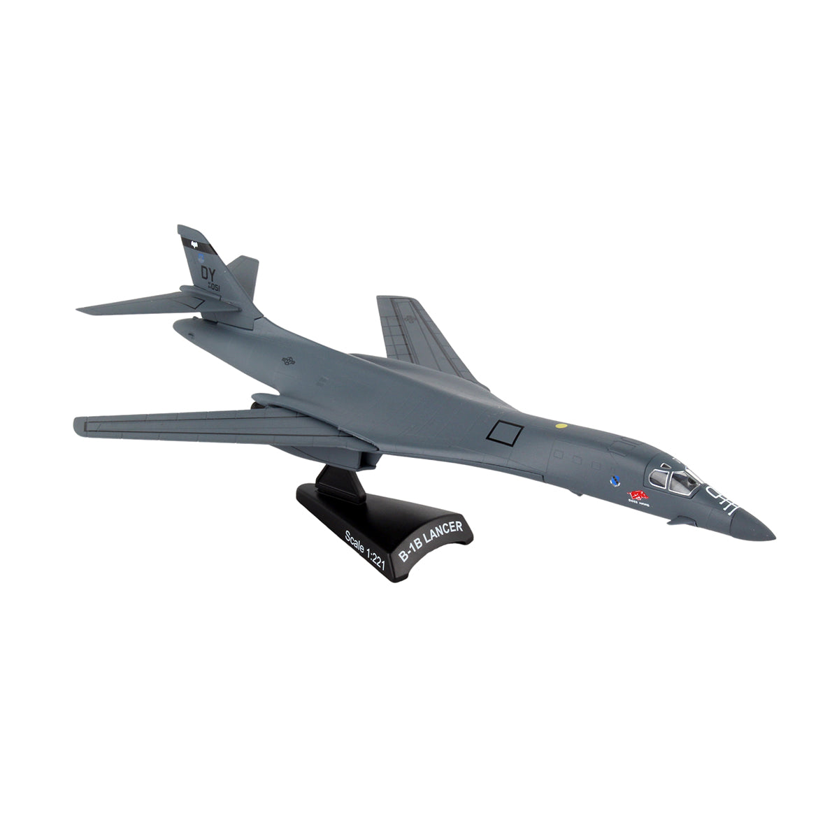 The DARON Boeing B-1B Lancer "Boss Hawg" Diecast Model, featuring swept wings and US Air Force insignia near the cockpit, is displayed on a black stand labeled B-1B Lancer.