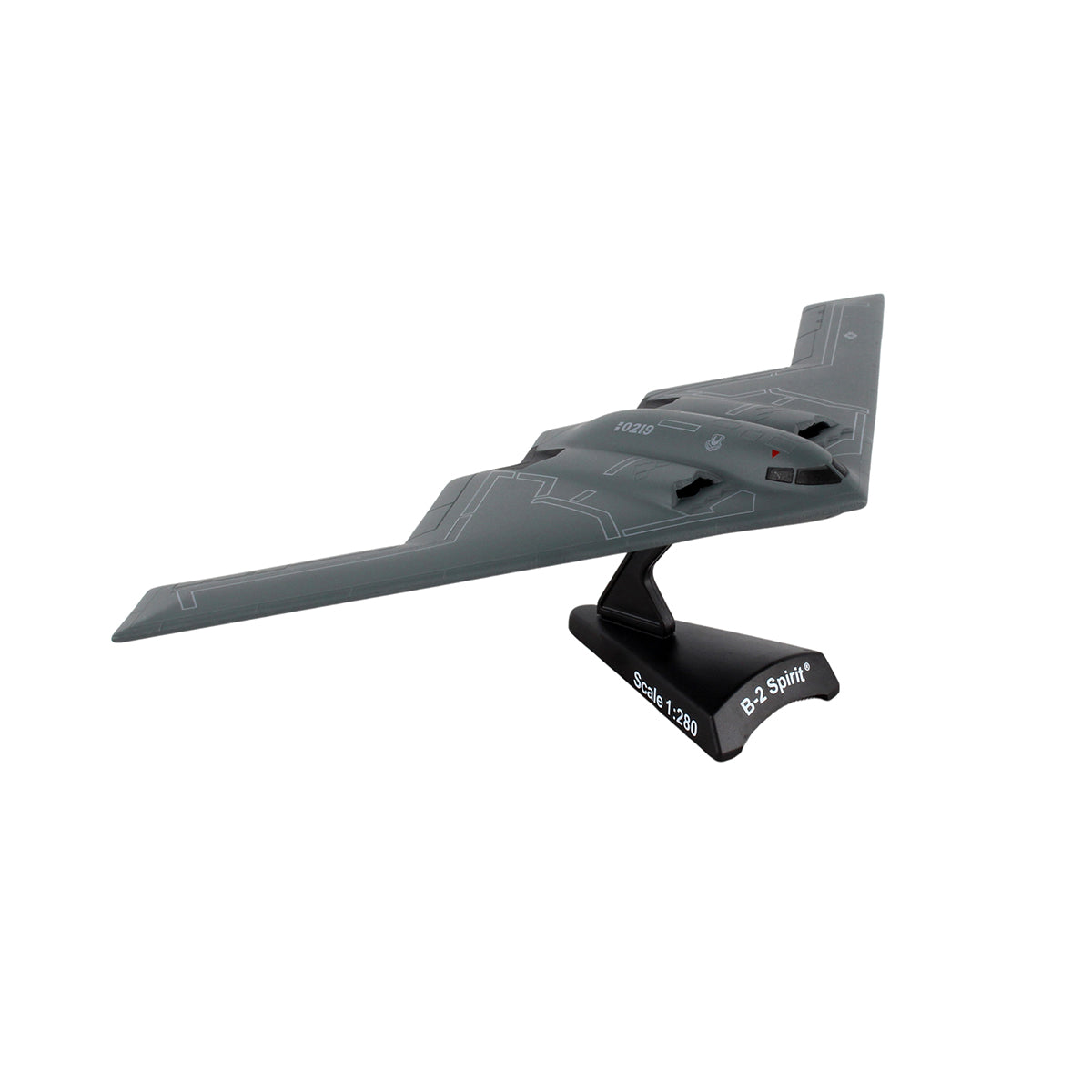 The DARON Boeing B-2 Spirit Diecast Model features a gray finish with white details, highlighting its unique flying-wing design, and is displayed on a black stand labeled Scale 1:320.