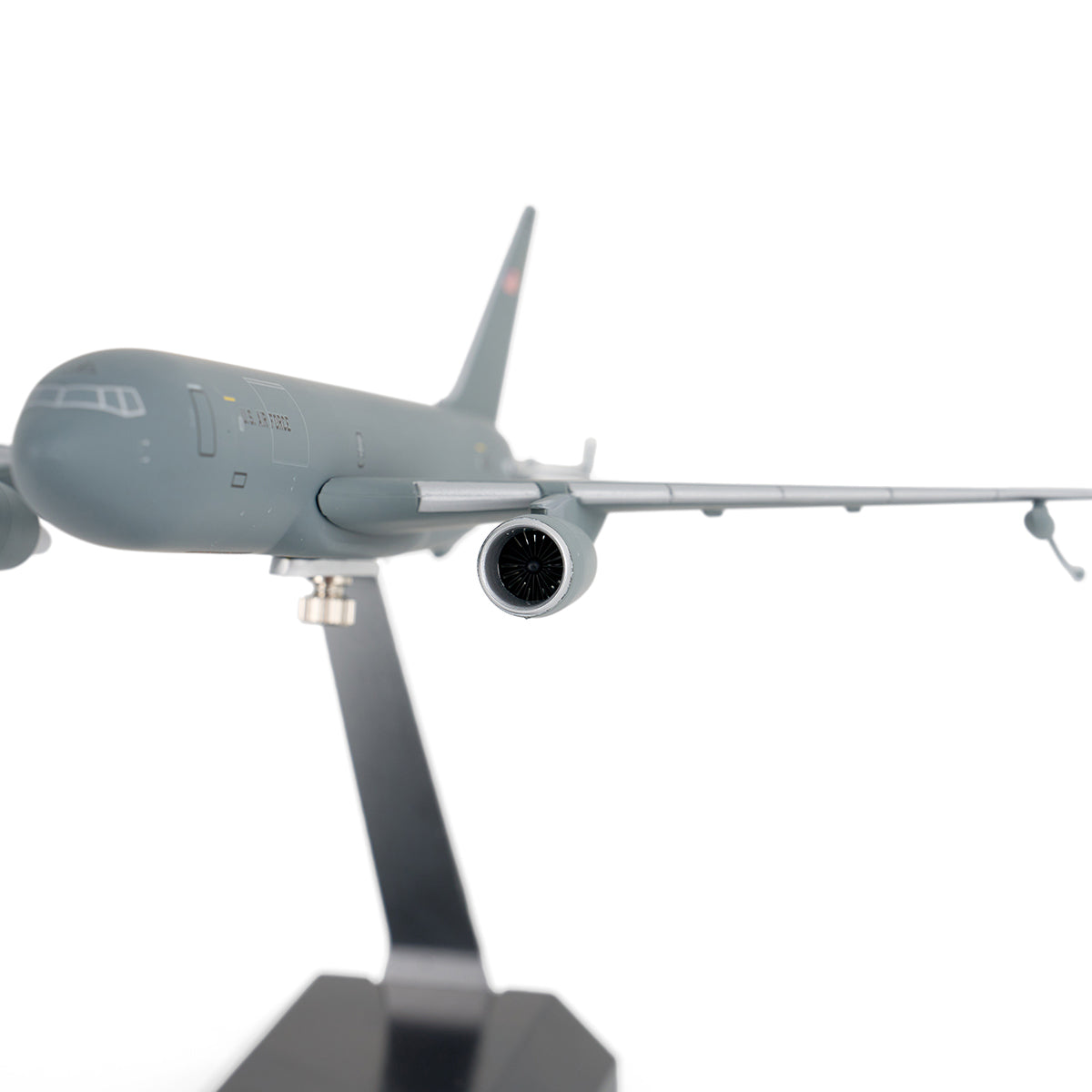 A close-up of the DARON Boeing KC-46A Pegasus 1:200 Model on a black stand, showcasing the front and right wing against a white background—ideal for collectors.