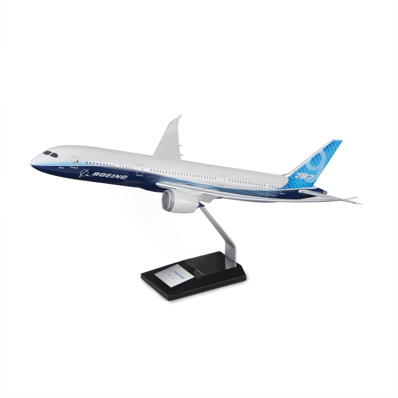 The PACMIN Boeing 787-9 Dreamliner Resin 1:100 Model, in blue, white, and gray, is mounted on a black display stand and displayed against a white background.