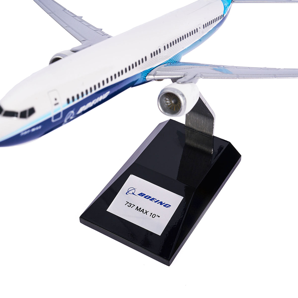 The Boeing Unified 737 MAX 10 1:144 Model by The Boeing Store features blue and white colors, a Boeing 737 MAX 10 label, Advanced Technology winglets, and is displayed diagonally with extended wings.