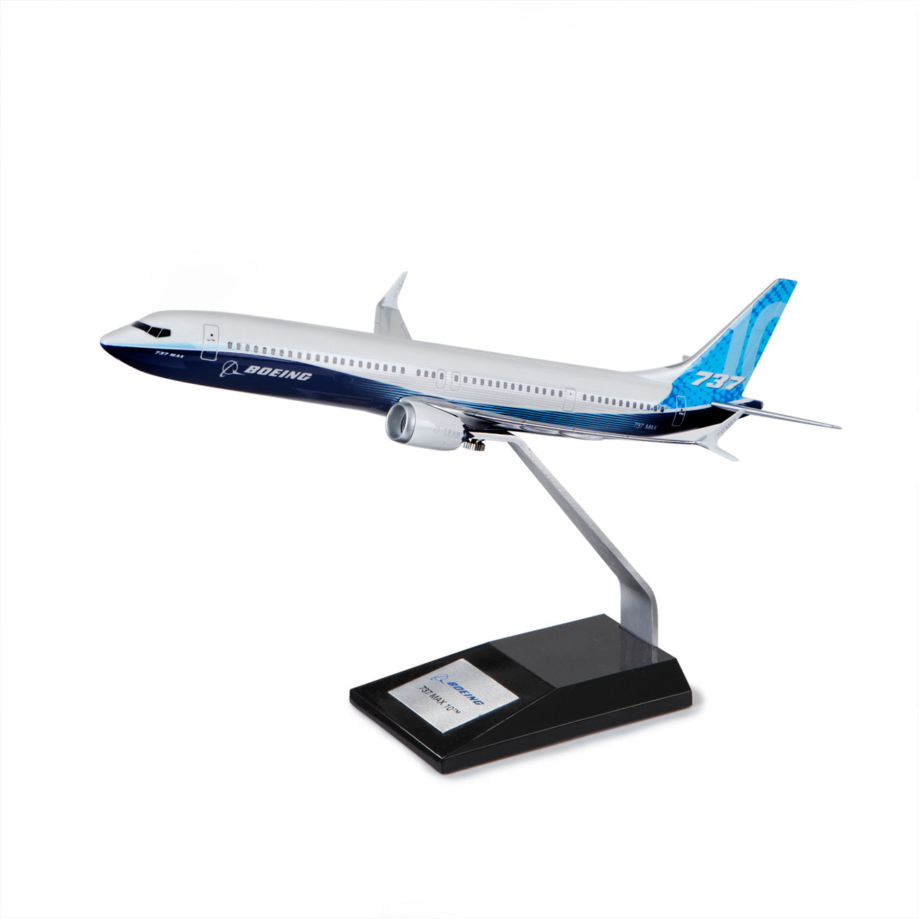 The PACMIN Boeing 737 MAX 10 Plastic 1:100 Model features blue and white livery, Advanced Technology winglets, and is displayed on a black stand with a plaque, angled to simulate flight.