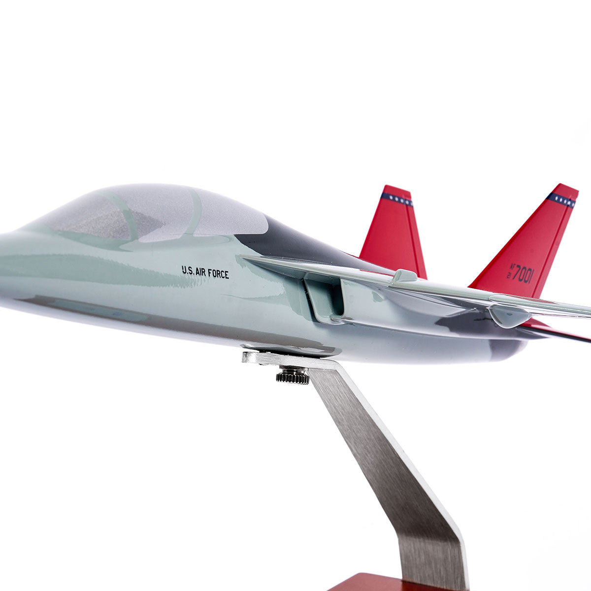The Boeing Store’s Boeing T-7A Red Hawk 1:48 Model features U.S. Air Force markings, red tail fins with blue and white stripes, detailed silk screen printing, and comes mounted on a metal stand against a white background.