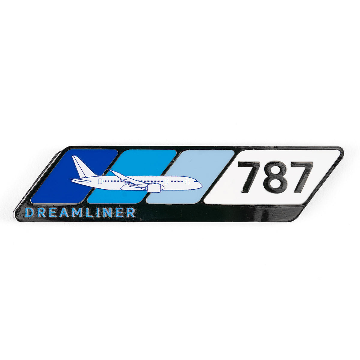 The Boeing 787 Dreamliner Velocity Magnet features the iconic logo with three diagonal blue stripes, a white airplane silhouette, DREAMLINER on the lower left, and 787 in black on the right. Perfect for aviation enthusiasts.