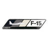 The Boeing F-15 Eagle Velocity Magnet features an enamel badge with a fighter jet silhouette against a three-toned dark gray, gray, and white backdrop. The words F-15 and Eagle capture the essence of flight passion.