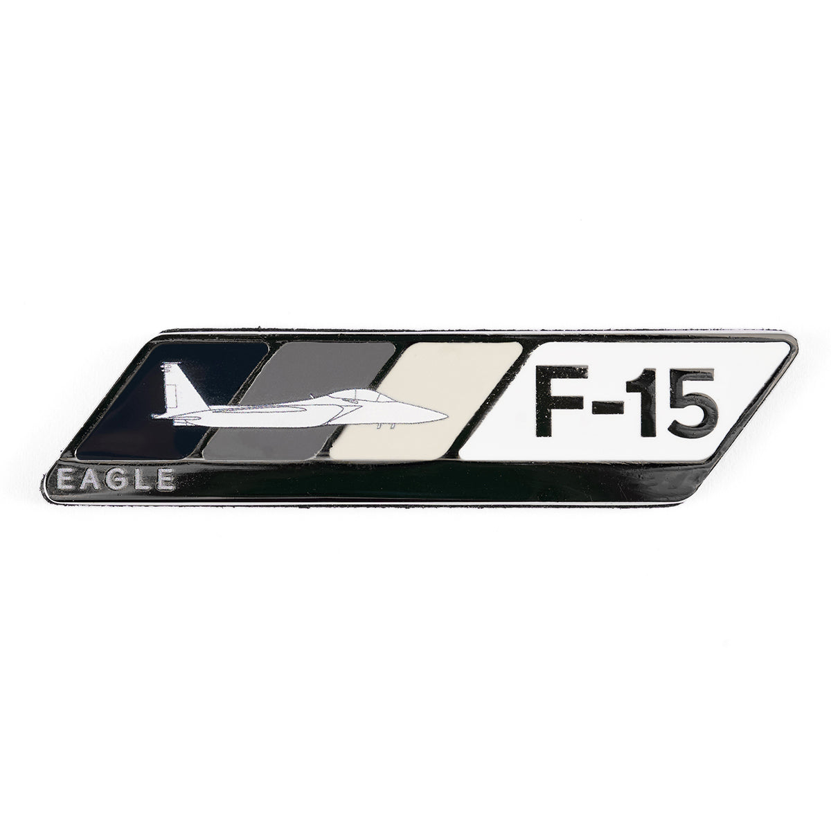 The Boeing F-15 Eagle Velocity Magnet features an enamel badge with a fighter jet silhouette against a three-toned dark gray, gray, and white backdrop. The words F-15 and Eagle capture the essence of flight passion.