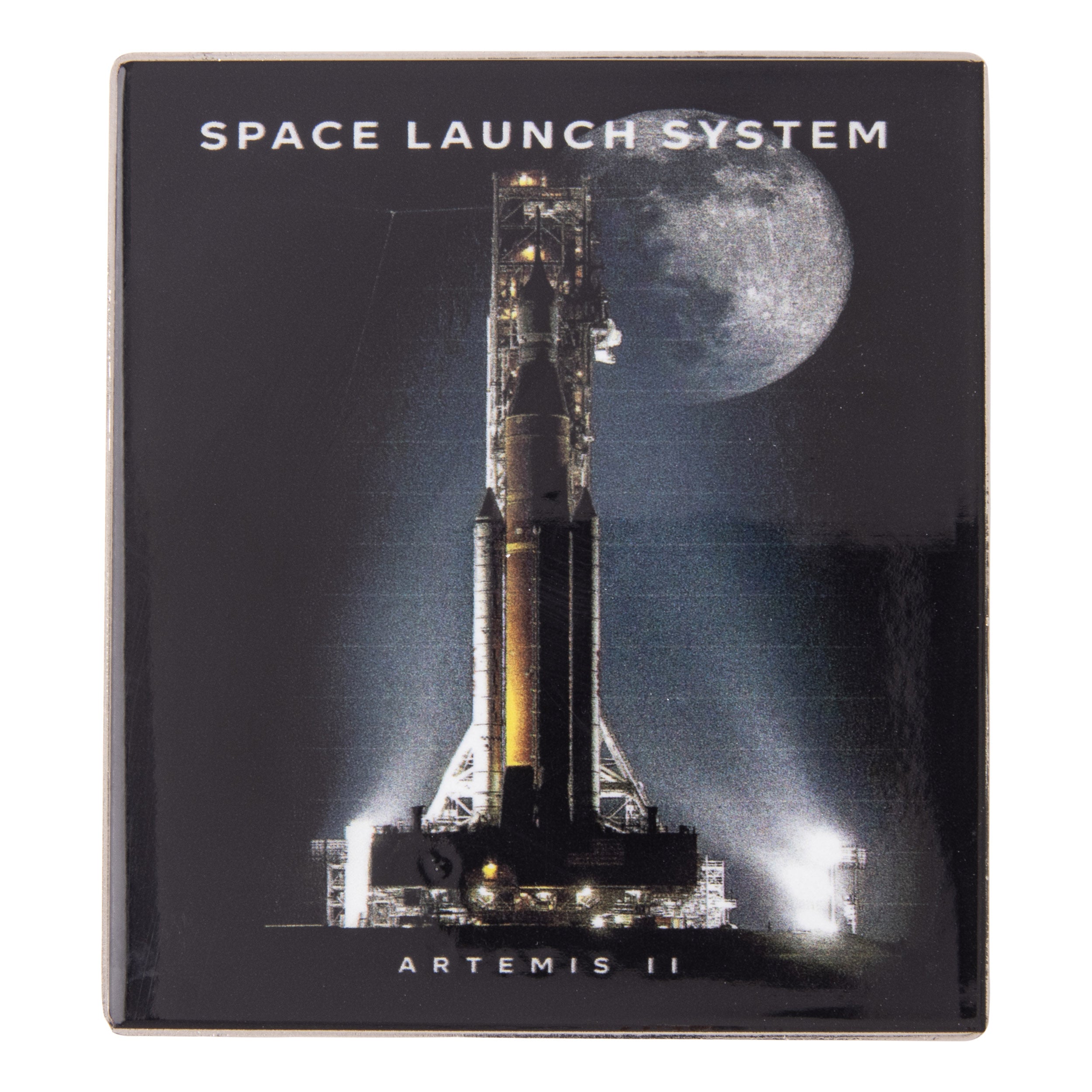 Square Boeing SLS Artemis II Graphic Magnet featuring the Space Launch System rocket on a launchpad at night with the moon in the background, labeled SPACE LAUNCH SYSTEM at the top and ARTEMIS II at the bottom.