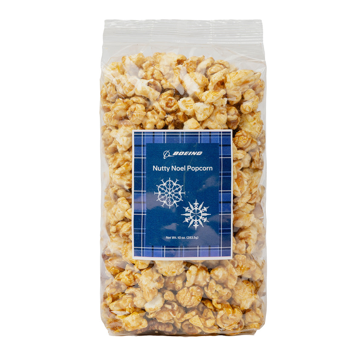 A clear bag of holiday popcorn labeled “Boeing 2026 Jet Snowflake Nutty Noel Popcorn” from BOEING, featuring snowflake graphics and a Boeing logo on a blue plaid background.