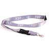 The Boeing Stores Boeing 737 Motion Lanyard is gray with a repeated sublimation print of airplane graphics. It features a black plastic buckle and a metal clip, ideal for fans of aviation-themed accessories.
