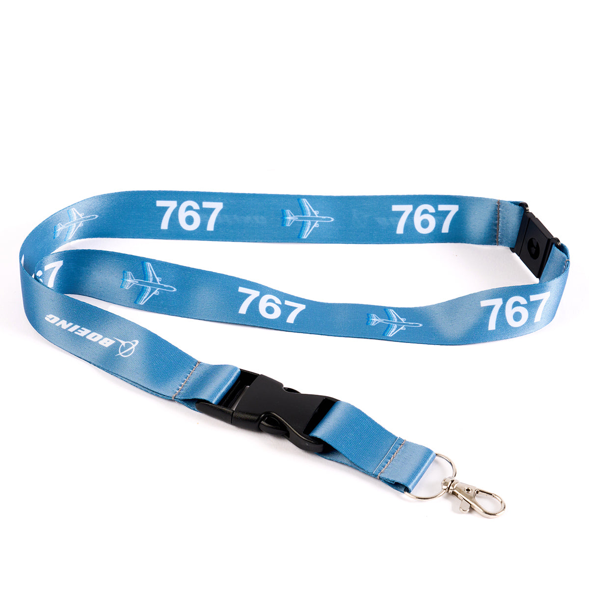 The Boeing Stores Boeing 767 Motion Lanyard boasts an aviation-themed print with a sleek airplane graphic, sturdy black plastic buckle, and metal clip. Boeing is elegantly printed near the clasp, adding distinction to this stylish accessory.