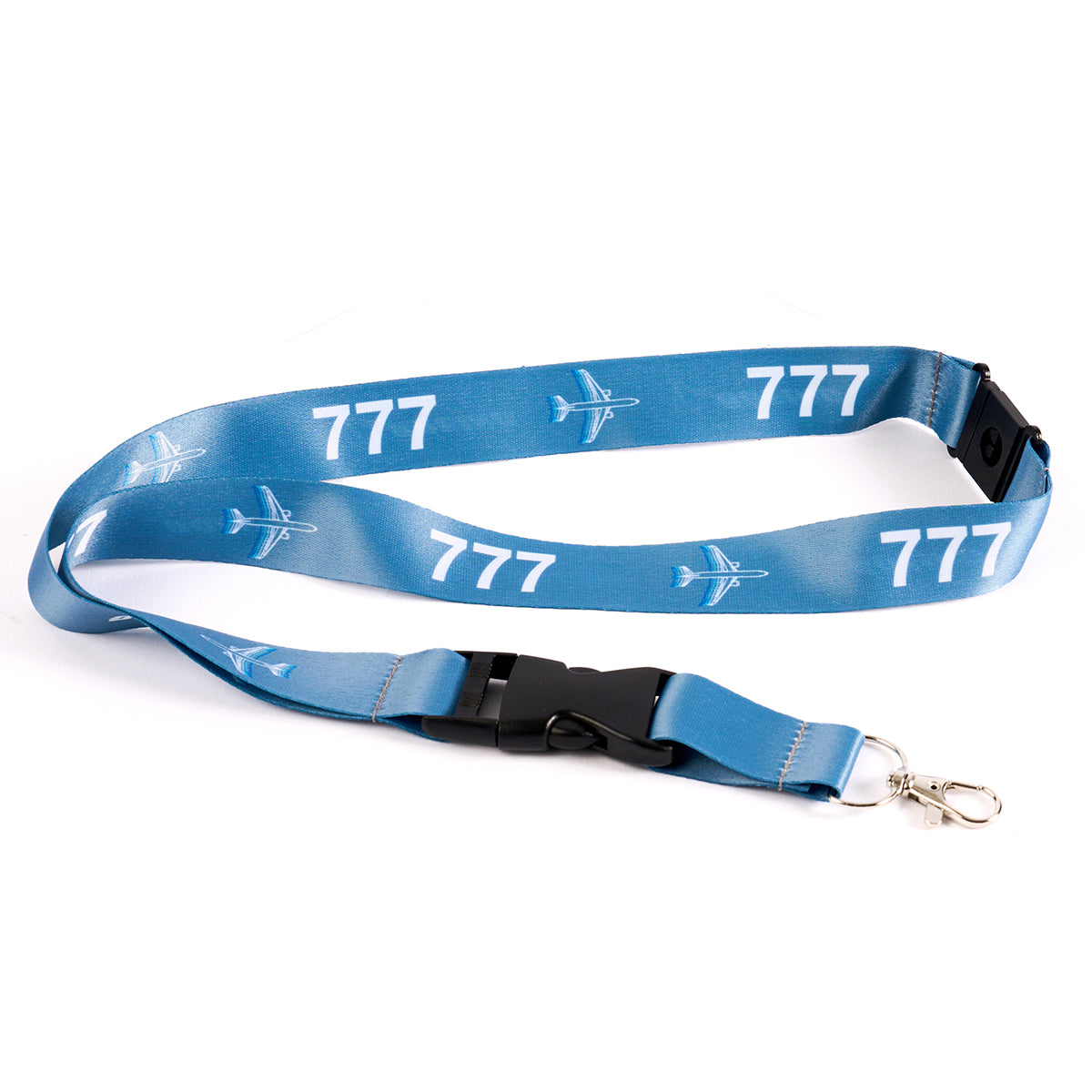 The Boeing Stores Boeing 777 Motion Lanyard, inspired by aviation, features a sublimation print with white airplane graphics and 777 on blue fabric. It includes a black plastic buckle and silver metal hook attachment, perfect for enthusiasts.