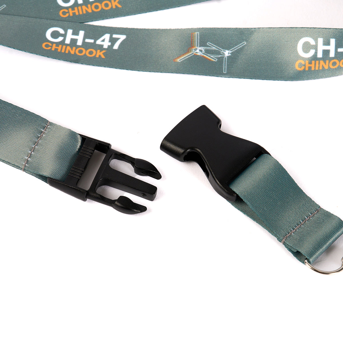 Close-up of The Boeing Stores aviation-themed CH-47 Chinook Motion Lanyard, showcasing a helicopter illustration with a plastic buckle and metal keyring.