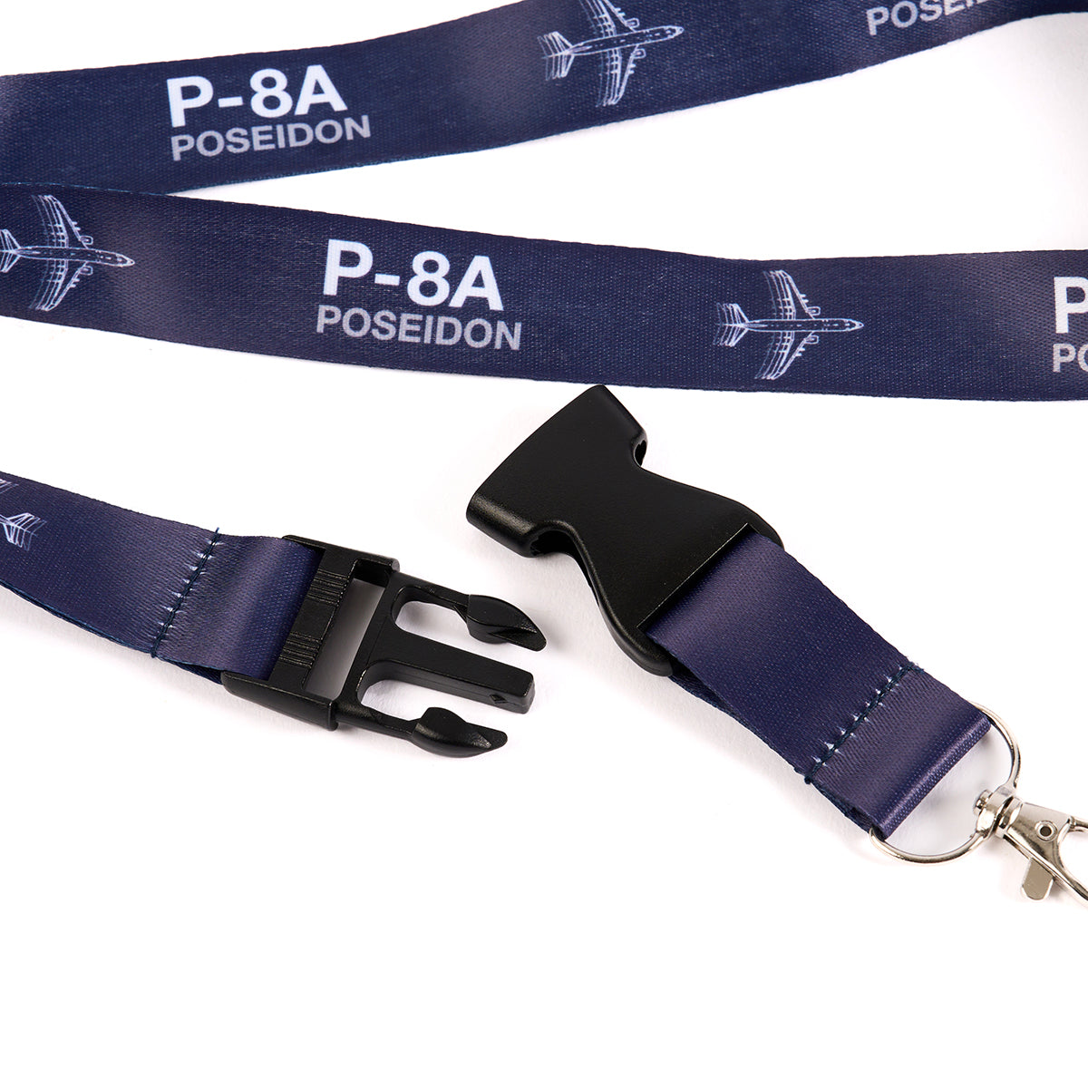 The Boeing Stores Boeing P-8A Poseidon Motion Lanyard, inspired by aviation, is a stylish and functional dark blue accessory featuring repeated plane graphics. It includes a plastic buckle and metal clip, perfect for any Boeing enthusiast.