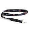 The Boeing Stores Boeing Space Launch System Motion Lanyard, with black lanyard and repeating rocket graphics, features SLS Space Launch System text inspired by aviation design. It comes with a black plastic buckle and a silver metal clasp for a sleek look.