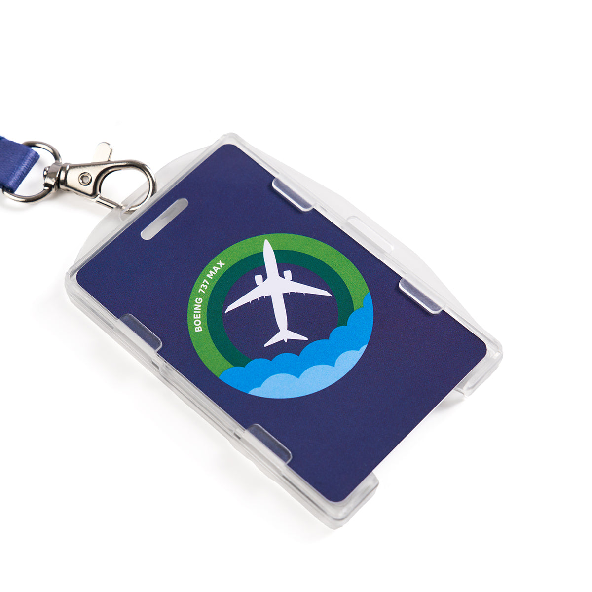 The Boeing 737 MAX Skyward Lanyard by Boeing features a blue sublimation-printed design with an airplane and stylized clouds, encircled by a green ring, and elegant light green text reading BOEING 737 MAX.