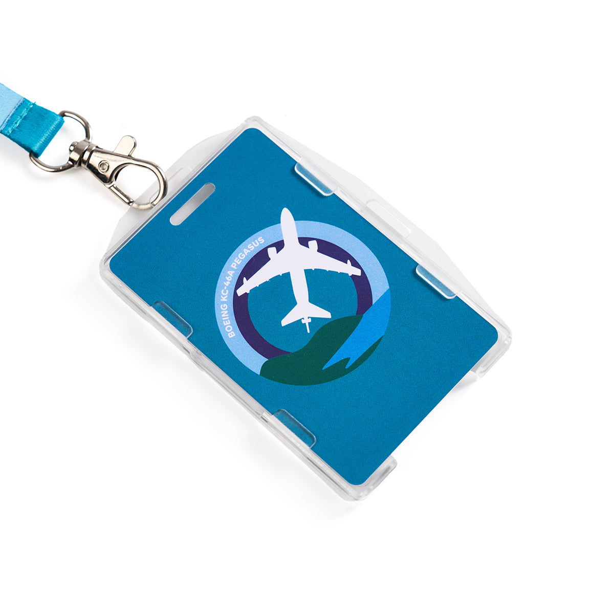 A blue Boeing KC-46 Pegasus Skyward Lanyard holds an ID card with a sublimation print of an airplane in a circle above waves. The text DRIVING REGIONAL PROGRESS arcs above, evoking the soaring flight of the Boeing KC-46 Pegasus.
