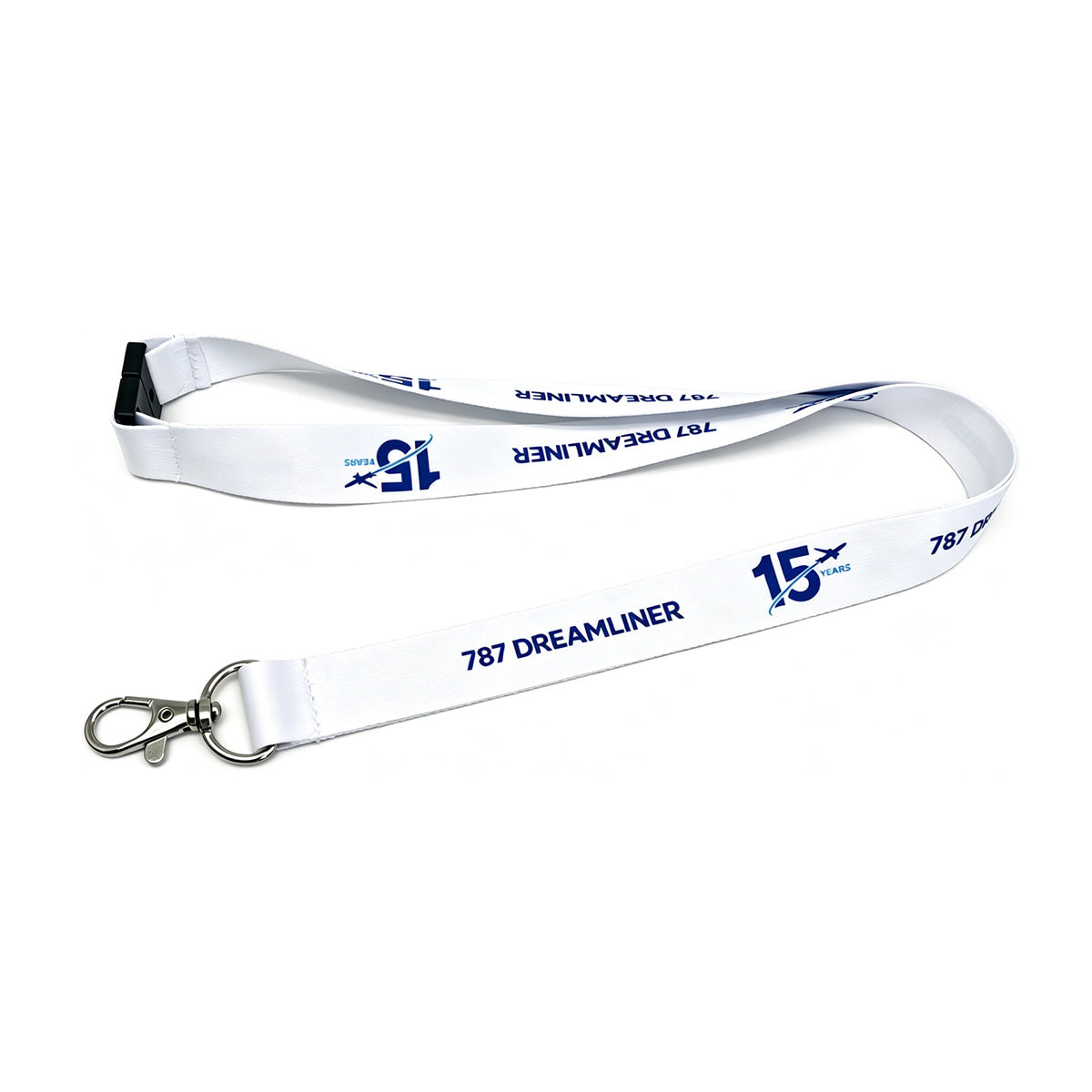 The BOEING 787 Dreamliner 15 Year Anniversary Lanyard is a white aviation lanyard featuring blue “787 DREAMLINER” and “15 YEARS” text alongside a BOEING logo. This pilot lanyard includes a metal clip and a black plastic buckle, and is shown on a white background.
