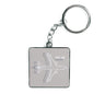 The Boeing KC-46 Pegasus Motion Keychain by The Boeing Store features a metal tag with the aircrafts outline on a gray background displaying its name. Equipped with a durable chain and ring, its perfect for aviation fans.