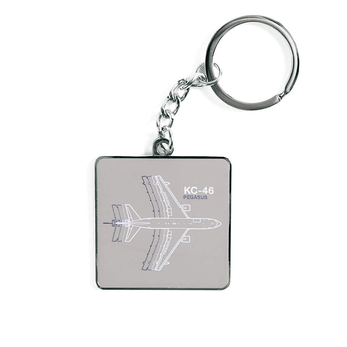The Boeing KC-46 Pegasus Motion Keychain by The Boeing Store features a metal tag with the aircrafts outline on a gray background displaying its name. Equipped with a durable chain and ring, its perfect for aviation fans.