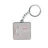 The Boeing Stores T-7A Red Hawk Motion Keychain features an aviation-themed square metallic design with a chain and ring. A line drawing of the T-7A Red Hawk aircraft in white and red is set against a gray backdrop—ideal for Boeing fans.
