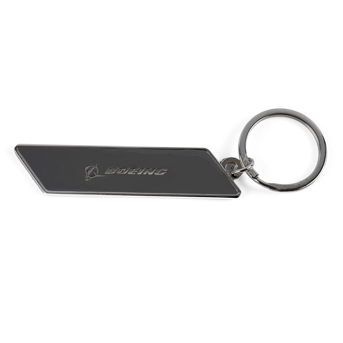 The Boeing F-15 Eagle Velocity Keychain is perfect for aerospace enthusiasts, featuring a sleek, angular design with Boeing and its iconic logo engraved on its silver surface. It includes a round metal ring and comes set against a plain white background.