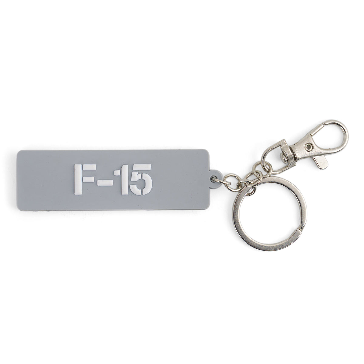 The BOEING F-15 Eagle Series Keychain features a rectangular gray design with white F-15 text, attached to a metal keyring and clasp—an ideal accessory for aviation enthusiasts.