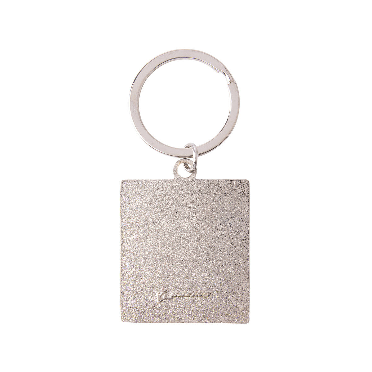 Back side of a square metal Boeing V-22 Osprey Graphic Keychain with a textured surface and a small engraved logo at the bottom.