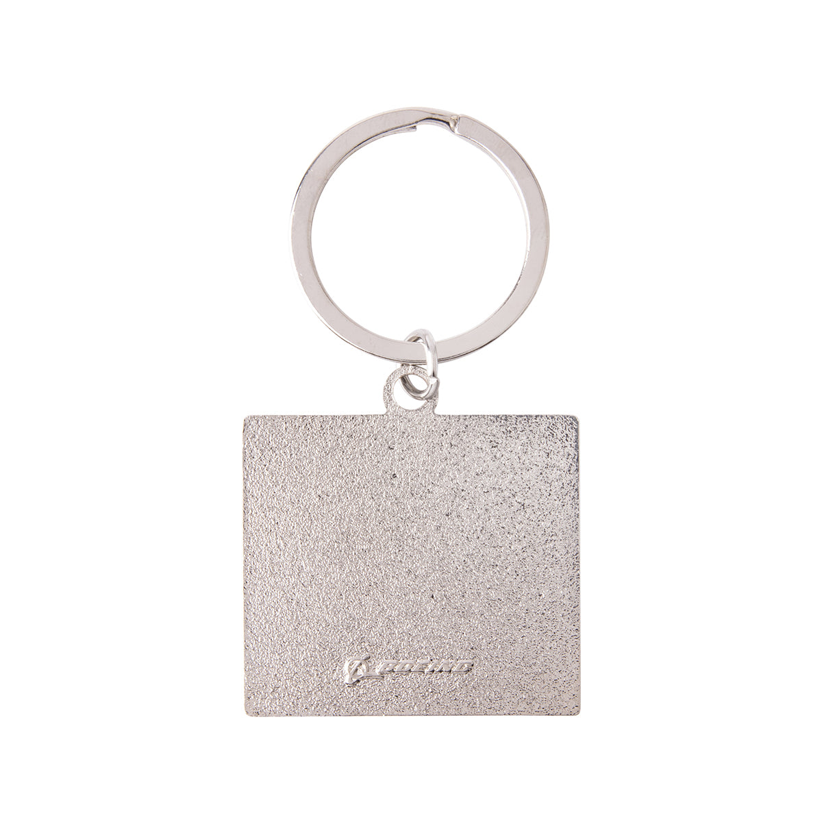 Square silver-toned Boeing MQ-28 Ghost Bat Graphic Keychain with a textured surface and a logo embossed at the bottom.