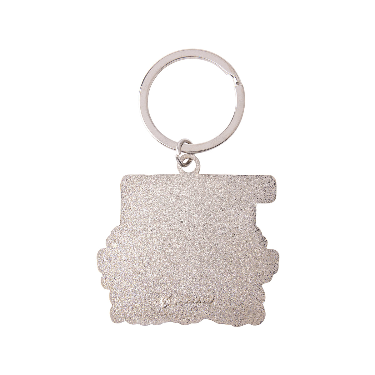 The reverse side of a metallic, textured Boeing T-7A Red Hawk Graphic Keychain with a circular split ring.