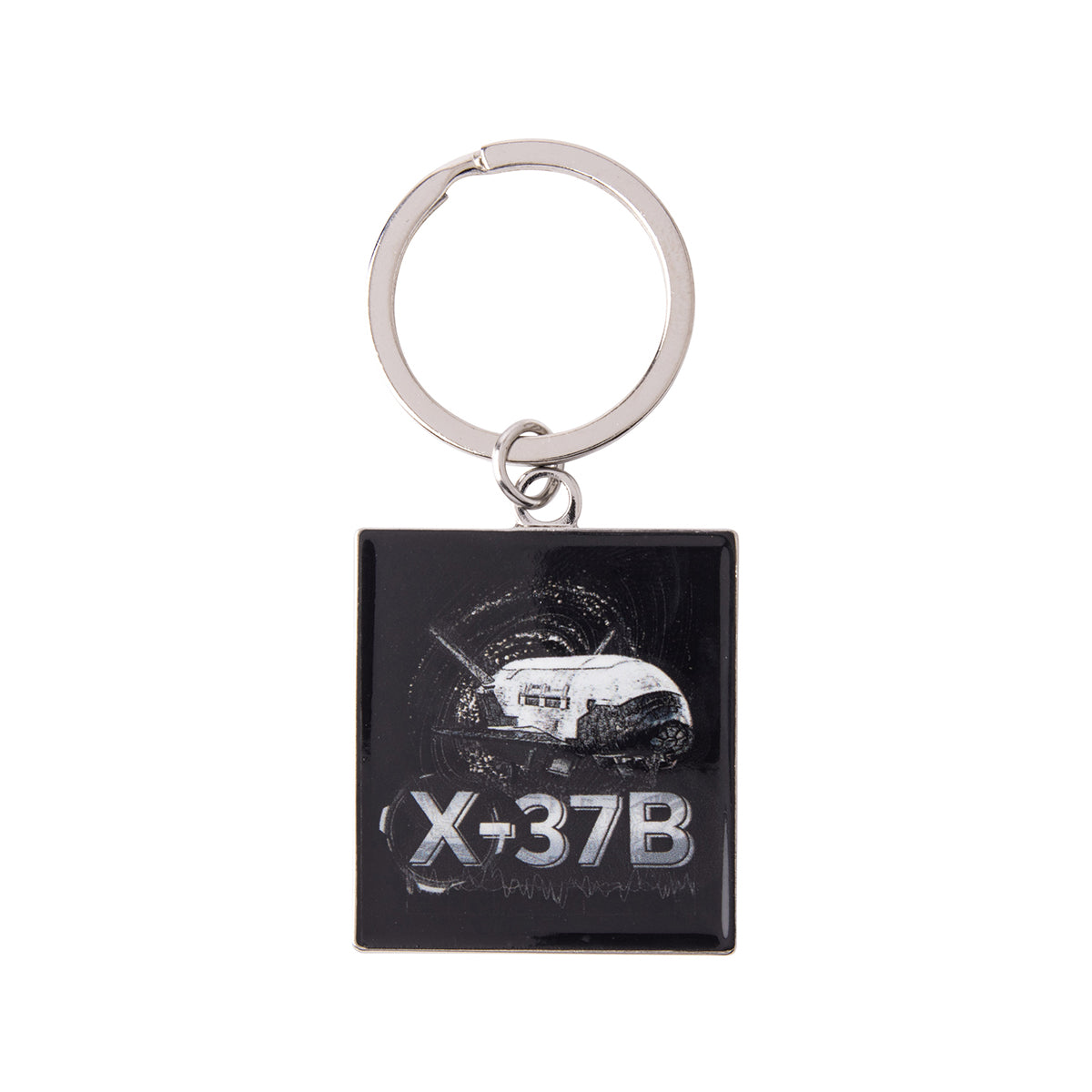 Square metal Boeing X-37B Orbital Test Vehicle Graphic Keychain featuring a graphic of the space plane against a black background.