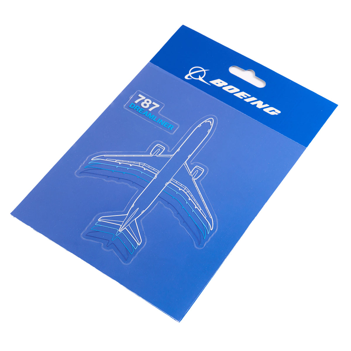 The blue packaging, showcasing a stylized Boeing 787 Dreamliner outline, contains a keychain and The Boeing Stores 787 Dreamliner Motion Sticker pack. The package prominently features the Boeing logo and 787 Dreamliner text.