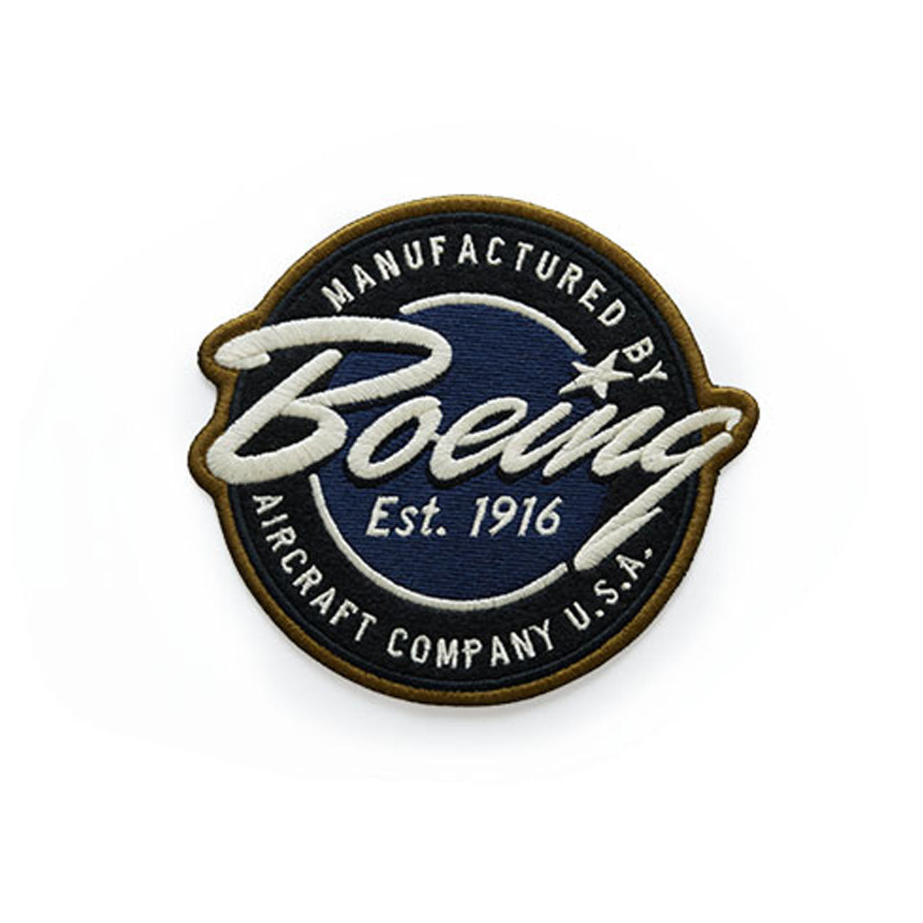 Round embroidery patch bearing Manufactured by Boeing Aircraft Company U.S.A. in white on blue, bordered in brown. Includes Est. 1916 and a star near the top, featuring the iconic Boeing script logo. Product: Red Canoe Boeing Script Logo Patch by The Boeing Store.