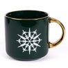 Dark green mug with gold handle and gold ring around the top lip of the mug.  White Jet Snowflake features the 787 Dreamliner, T-7A Red Hawk and Space Launch System