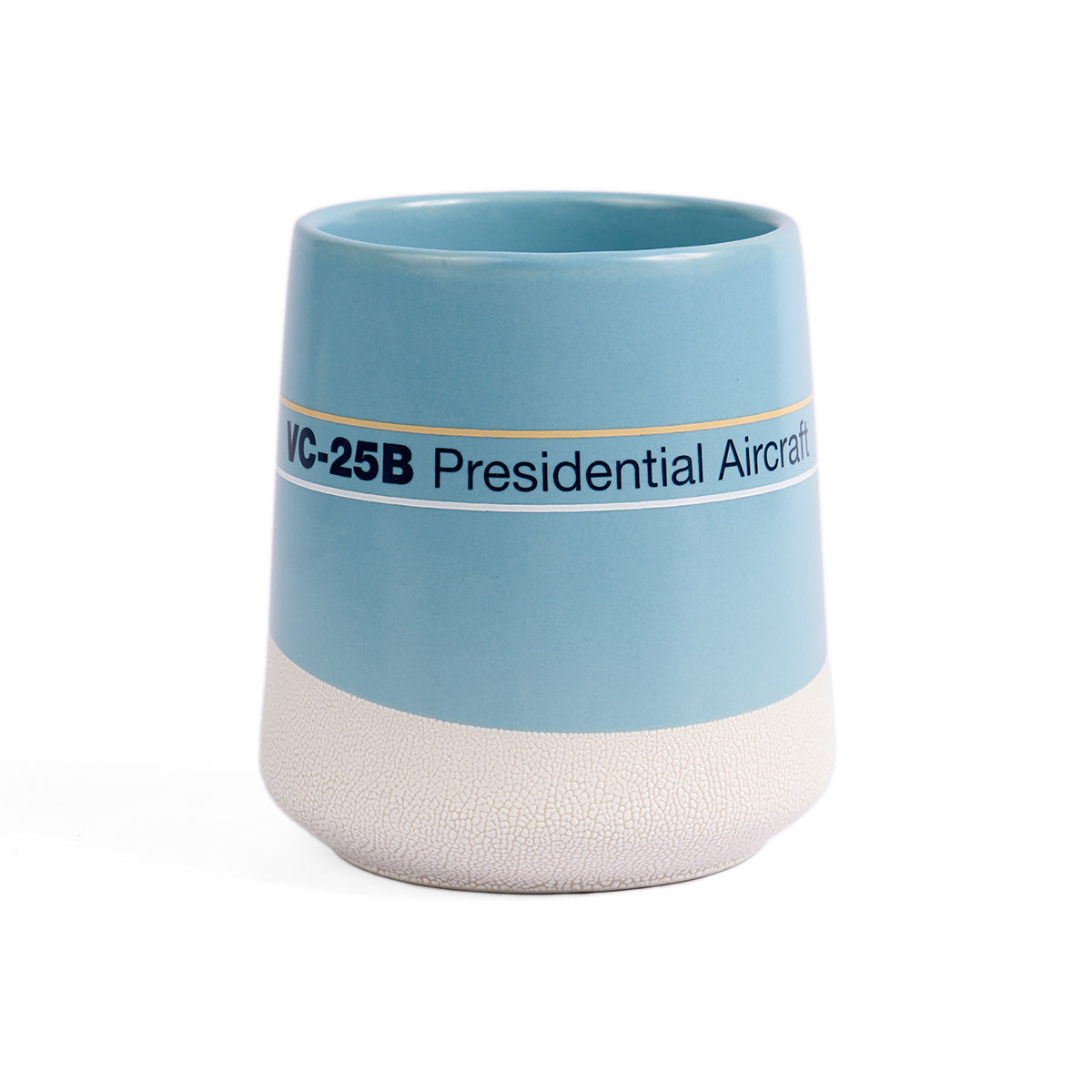Light blue and white ceramic mug with "VC-25B Presidential Aircraft" text. Sleek design, textured base, conveying a modern, official vibe.